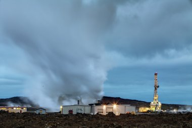 Geothermal power plant at night clipart