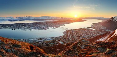 Norway city panorama - Tromso at sunset clipart
