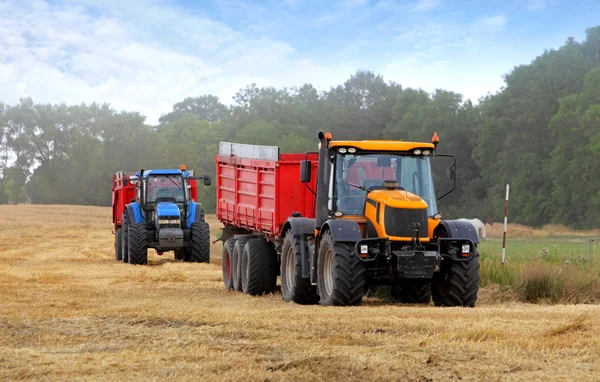 Tractors on harvest — Stock Photo, Image