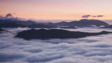 Meadows and Hills in  Mountains National Park over clouds, Slovakia landscape in autumn, Time lapse at sunset