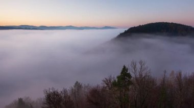 Time lapse of Slovakia forest autumn panorana landscape with mist in mountain, Manin