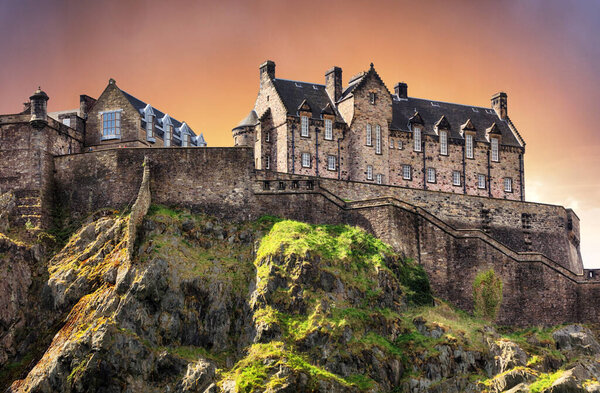 Scotland - Edinburgh Castle with green garden at dramatic sunset, UK