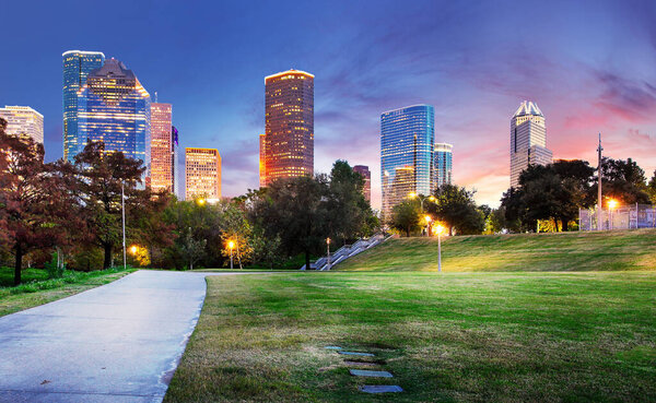 Houston Texas Skyline with modern skyscrapers and blue sky view from park river US