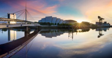 Glasgow panorama at dramatic sunrise with Clyde river, Scotland