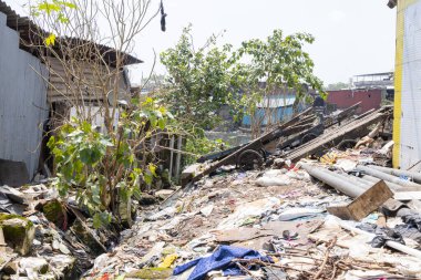 Mumbai,India-7-28-2022: Garbage dumped on the banks on Meeti river sweet river near Kalina area.