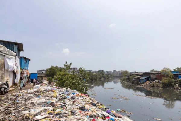 Mumbai,India-7-28-2022: Garbage dumped on the banks on Meeti river sweet river near Kalina area.