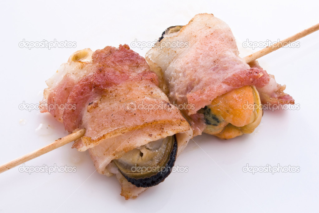 Shish kebab of mussels in bacon