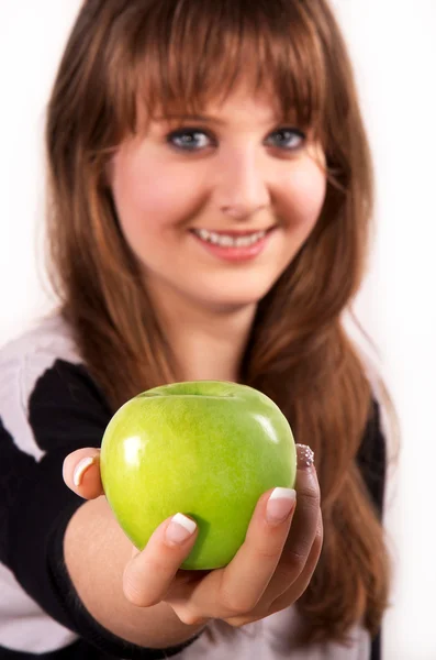 Teen girl and an apple — Stock Photo, Image