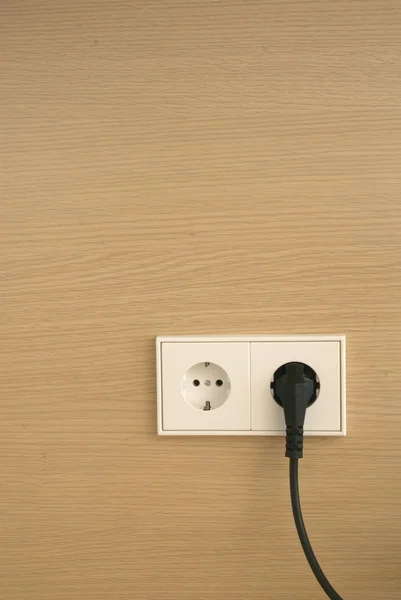 Wall outlet with power cord — Stock Photo, Image