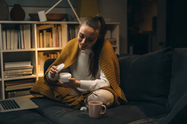 Woman Applying Hand Creme Sitting Home — Stock Photo, Image
