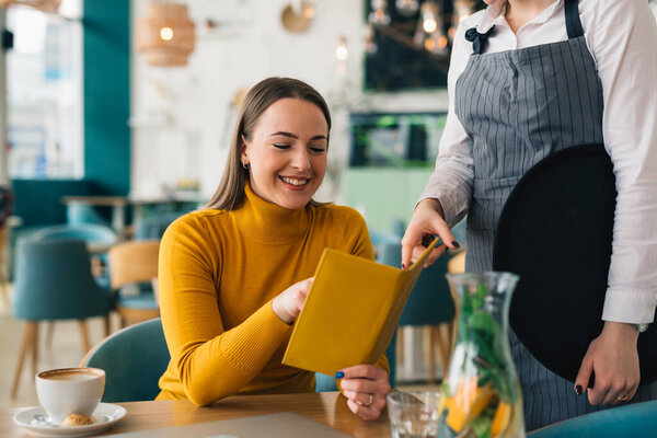 woman ordering food in restaurant