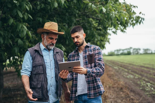 farmers talking outdoor on field