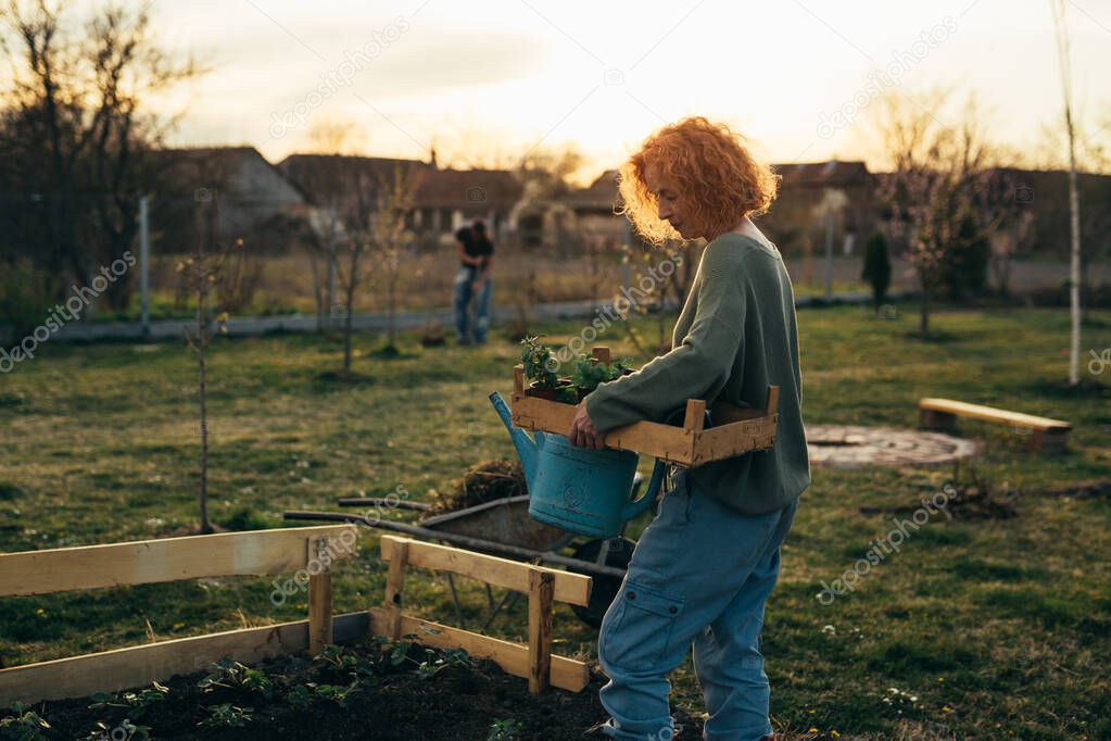 woman gardening vegetables in her backyard