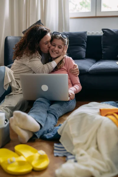 Mother Daughter Looking Summer Destination Laptop Computer While Packing Baggage — Stockfoto