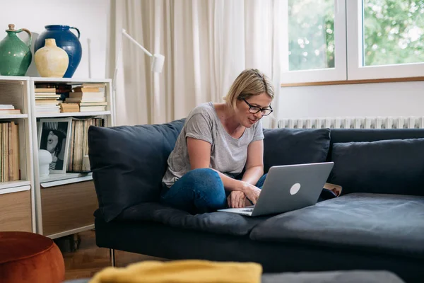 Caucasian Woman Checking Mails Laptop Sitting Sofa Living Room — Stock Fotó