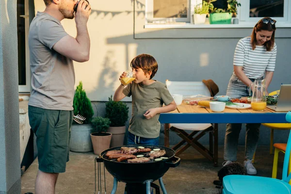 Family Three Enjoying Time Together Preparing Barbecue Home Backyard — Stockfoto