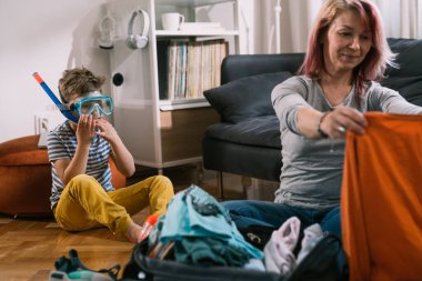 boy with his mother spending time together at home 