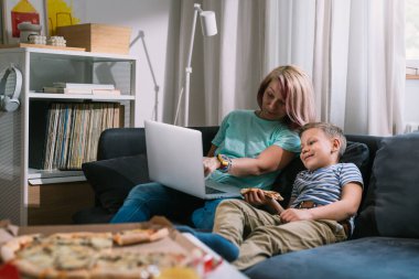 boy with his mother spending time together at home 