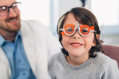 boy checking his eyesight in clinic
