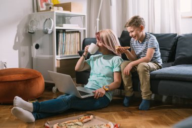 boy with his mother spending time together at home 
