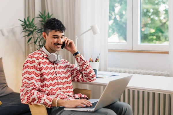 european college student working from his home