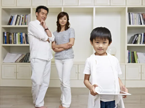 Cute boy and proud parents — Stock Photo, Image