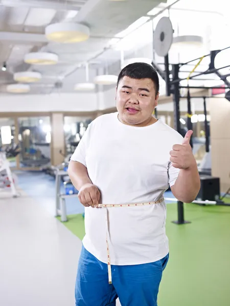 Overvægtige mand i gym - Stock-foto