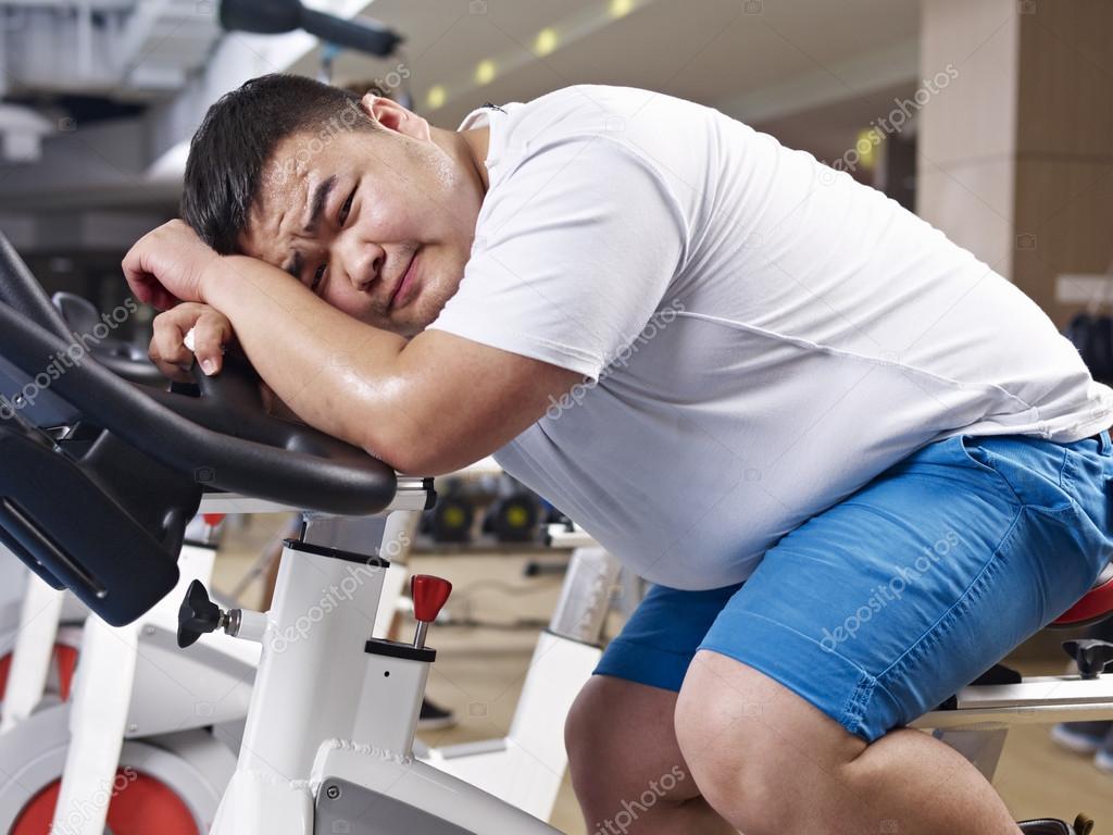 Overweight man exercising