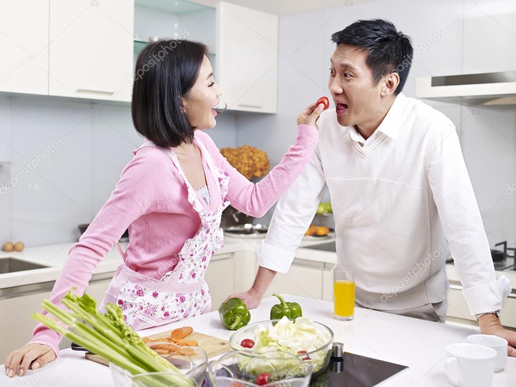 Asian couple in kitchen