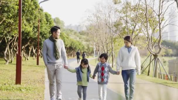 Happy Asian Family Two Children Taking Walk City Park — Stock Video