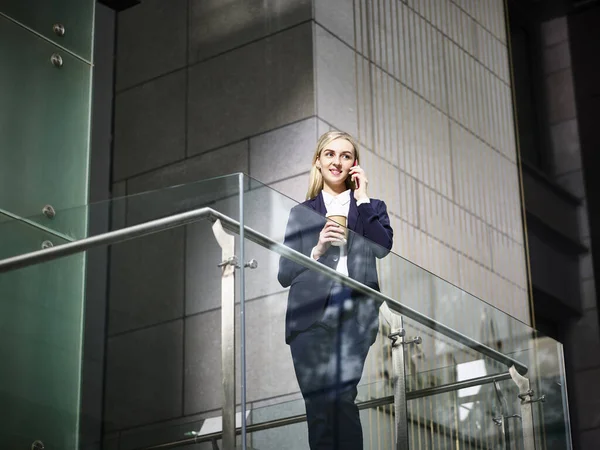 Young Caucasian Corporate Business Woman Standing Top Stairs Making Call —  Fotos de Stock