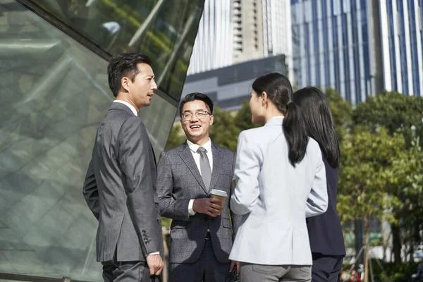 Group Four Young Asian Business People Standing Chatting Outdoors Street —  Fotos de Stock