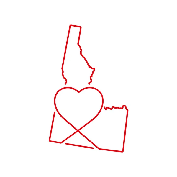 Idaho Amerikaanse staat rode omtrek kaart met de handgeschreven hartvorm. Vectorillustratie — Stockvector