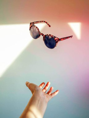Vintage sunglasses flowing in the air