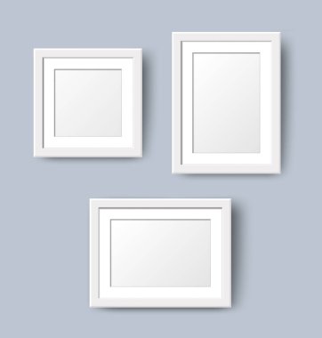 Realistic Empty Wall Photo Frame set. Vector white picture frames collage mockup template with shadow on grey wall background. Mockup for poster, banner, photo gallery, painting, presentation.
