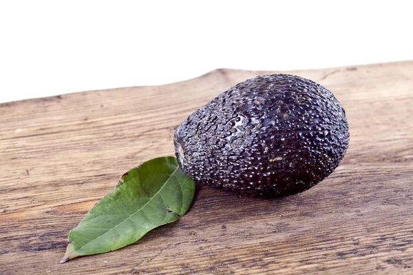Avocado on a table — Stock Photo, Image