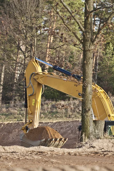 Grävmaskin Stockbild