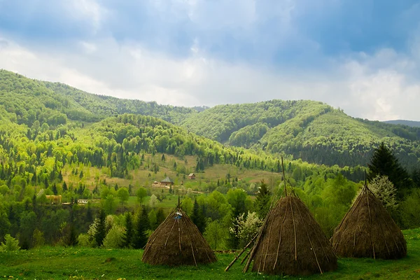 Beautiful view with three hayricks in mountains. Carpathian. Ukraine. — Stock Photo, Image