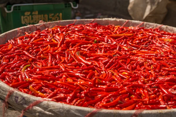 Small, red, very  spicy chilli peppers on an asian market. — Stock Photo, Image