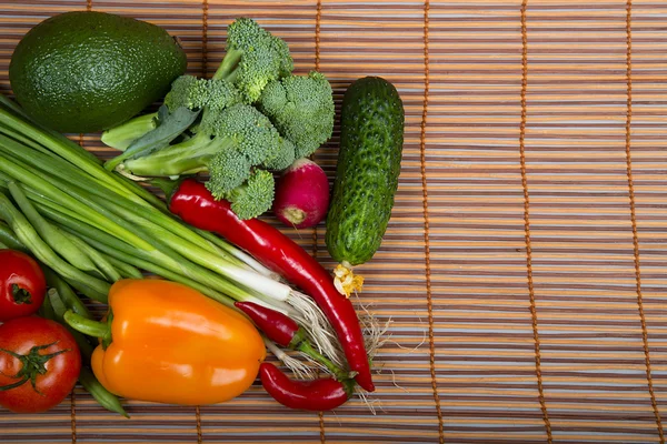 Composition of vegetables with avocado on a mat — Stock Photo, Image