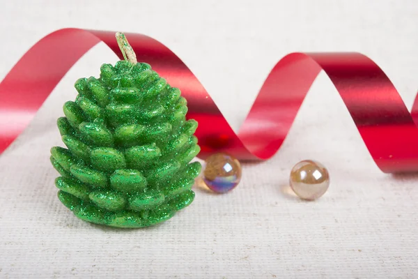 Composition from candle, ribbon and glass  beads — Stock Photo, Image