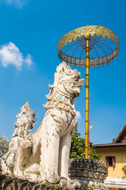 Golden umbrela and animals statue at Wat Saen Fang temple  in Chiang Mai, Thailand. Ancient construction of public property clipart