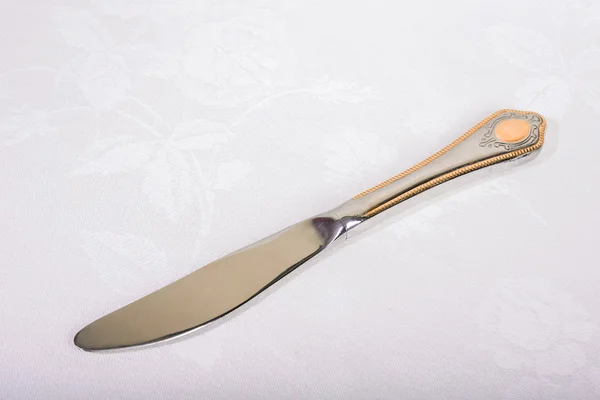 Nůž na bílém ubrousku — Stock fotografie