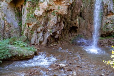 Beautiful waterfall on the mountain. Waterfall in the mountains of the North Caucasus.