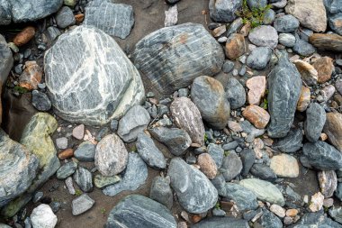 Photo river stones background, different shapesa nd colors