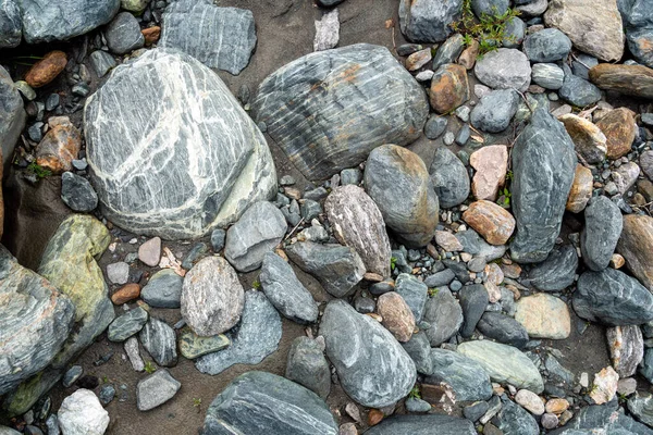 Photo river stones background, different shapesa nd colors