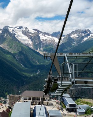 Photo travel to the region of the North Caucasus region - cable car from Mount Mussa-Achitara to the resort village of Dombay.