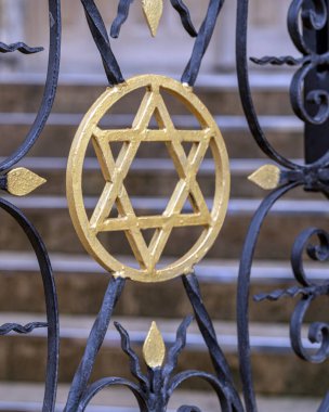 Photo star of David on the gate from the lattice at the entrance to the church