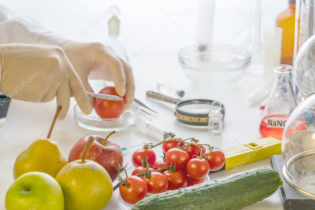 A food safety inspector checks vegetables from the market.