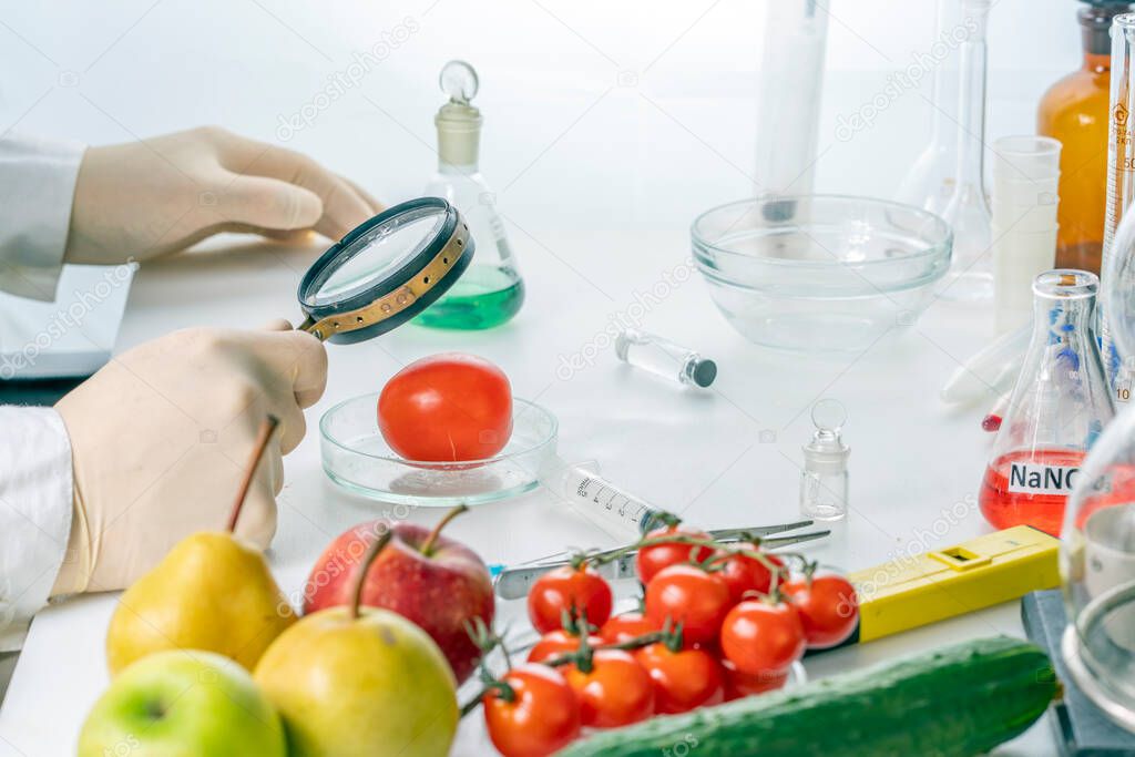 A food safety inspector checks vegetables from the market.